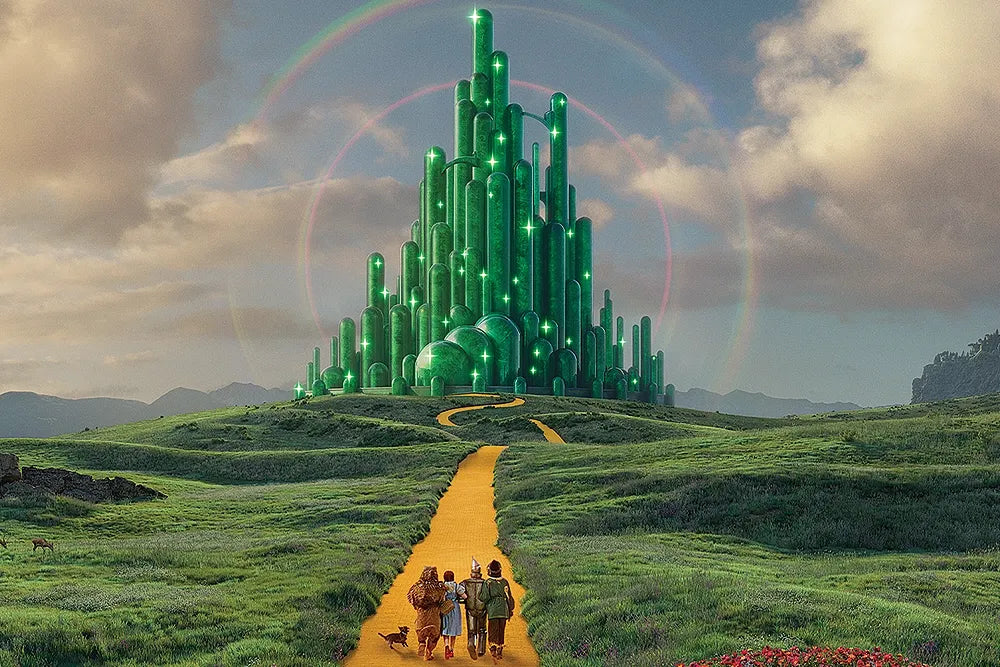 A closer view of the Emerald City and yellow road beneath a rainbow.