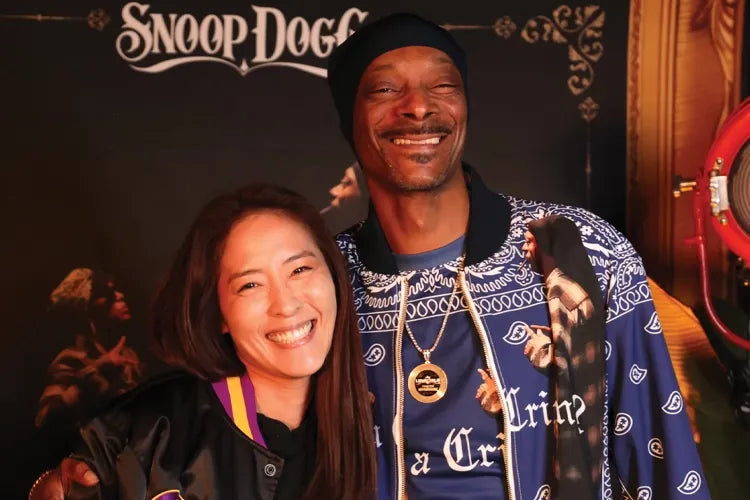 Tiffany Chin and Snoop Dogg smiling together.