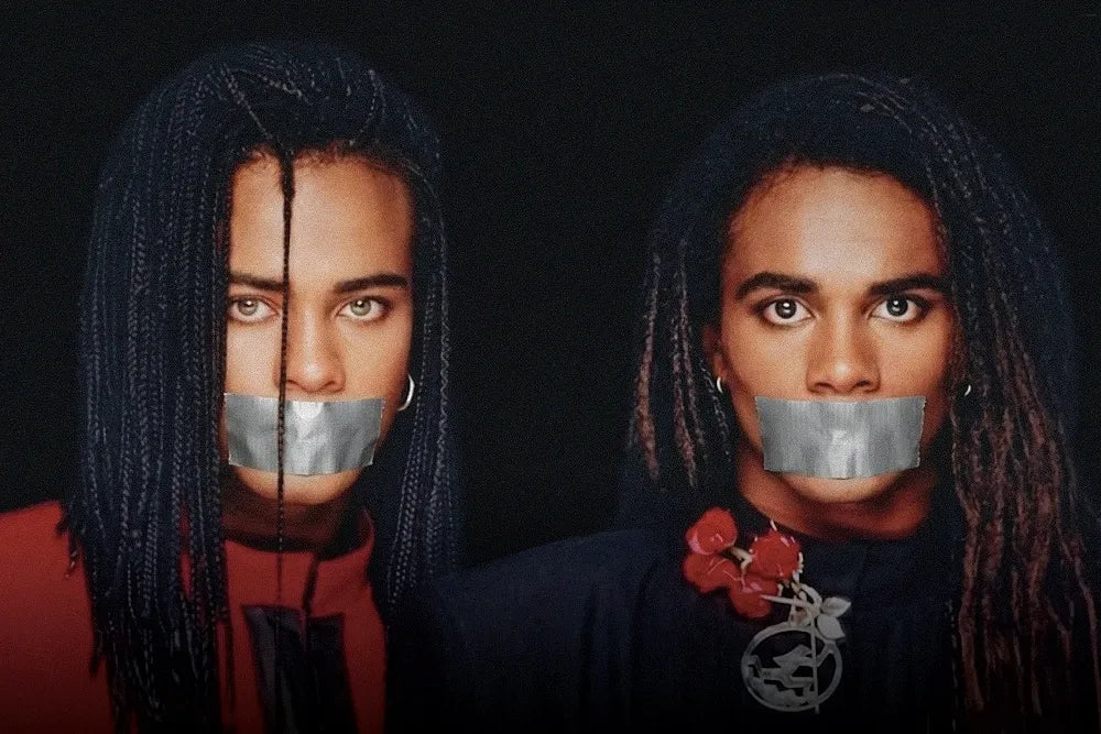 Milli Vanilli pose with silver tape across their mouths.