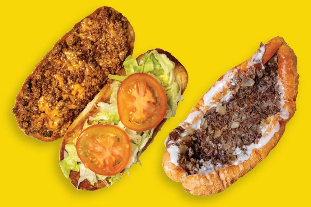 An open chopped-cheese sandwich beside a Philly cheesesteak on a yellow background.
