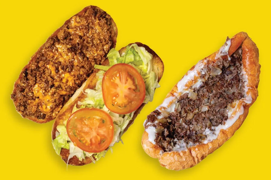 An open chopped-cheese sandwich beside a Philly cheesesteak on a yellow background.