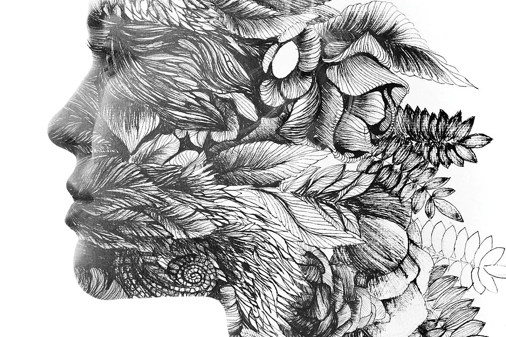A close crop of a human profile formed from layered leaves and flowers.