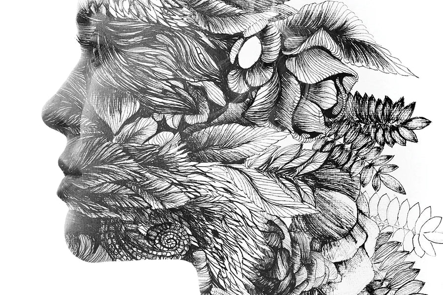 A close crop of a human profile formed from layered leaves and flowers.