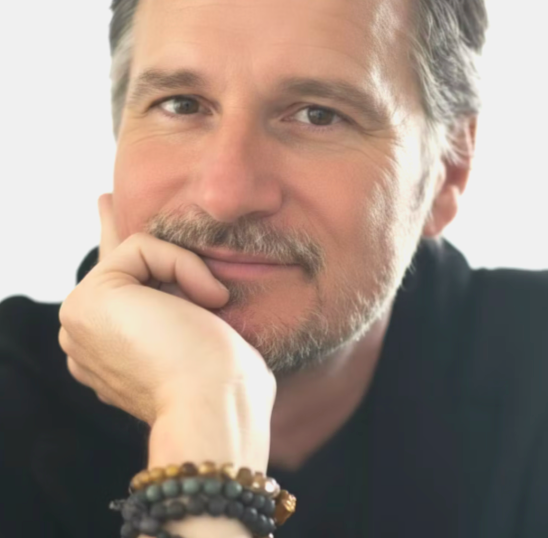 Rob Hill, Hiii co-founder and editor-in-chief, resting his chin on his hand.