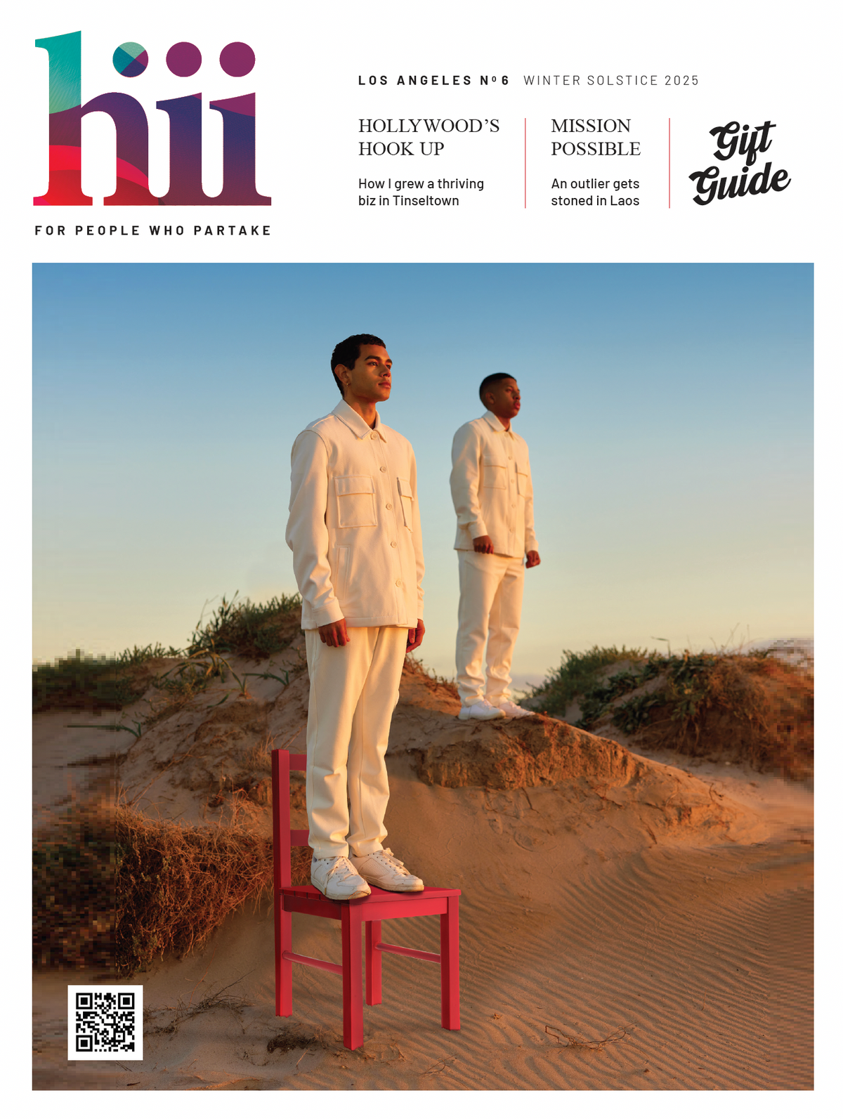 Hiii No. 6, Winter Solstice 2025: two men in white outfits on a beach dune, with a red chair and Gift Guide cover line.