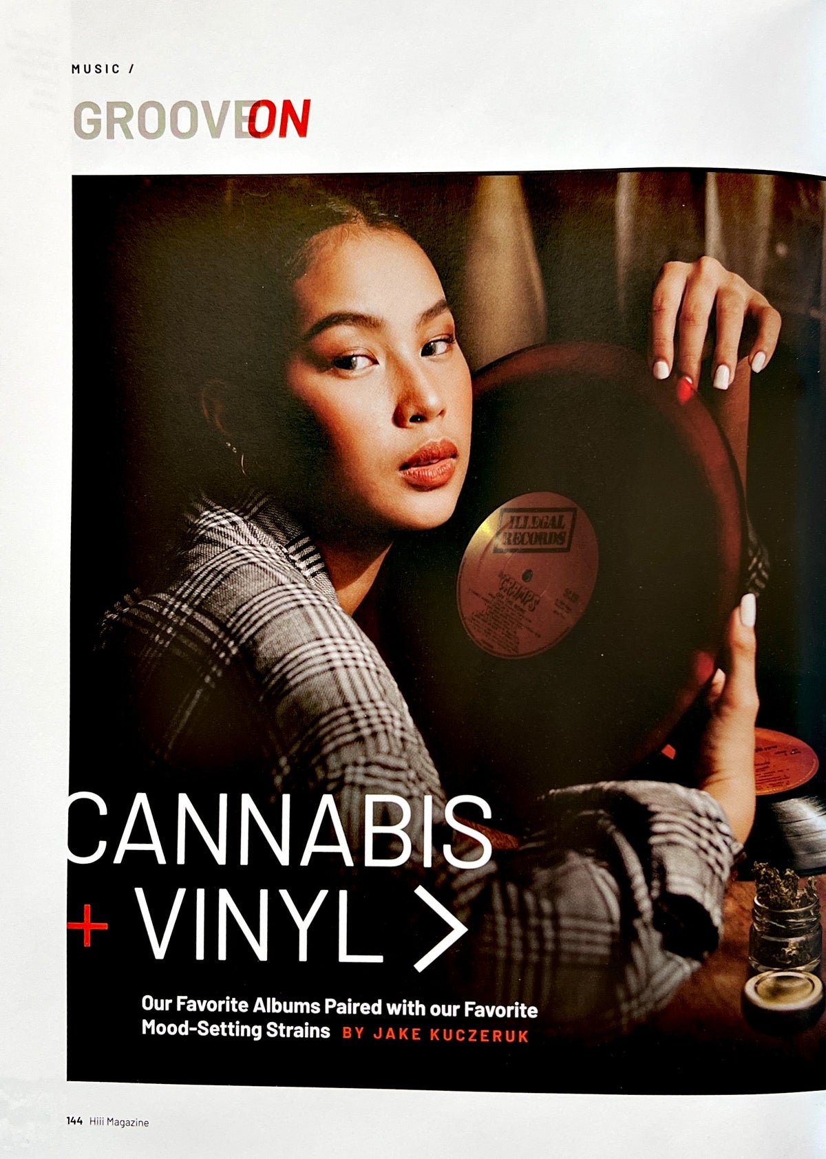 An interior Hiii page about cannabis and vinyl, showing a person holding a record.